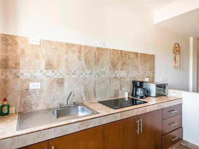 Equipped kitchen of an apartment at Villas Najo'